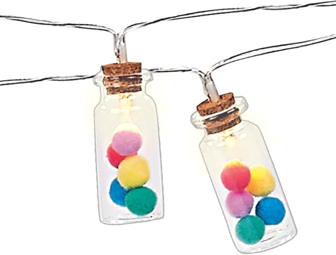 String lights in glass bottles with colorful pom-poms on a white background