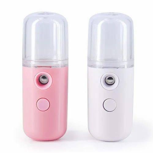 Two portable mist sprayers, one pink and one white, on a white background.