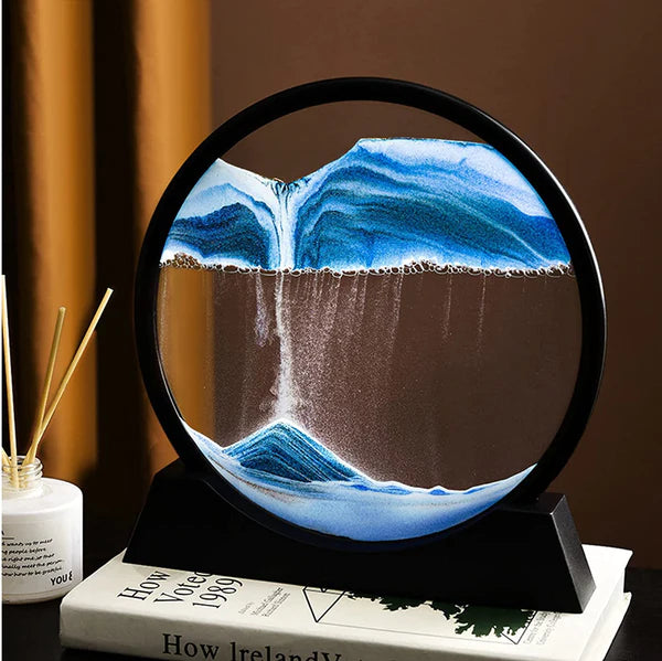 Decorative round object with blue and brown gradient on a black stand, placed on books.