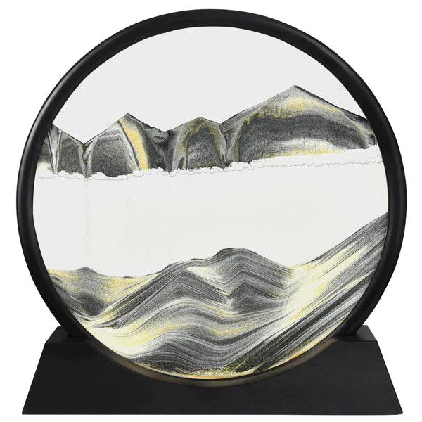 Round decorative piece with mountain and wave design on a black base