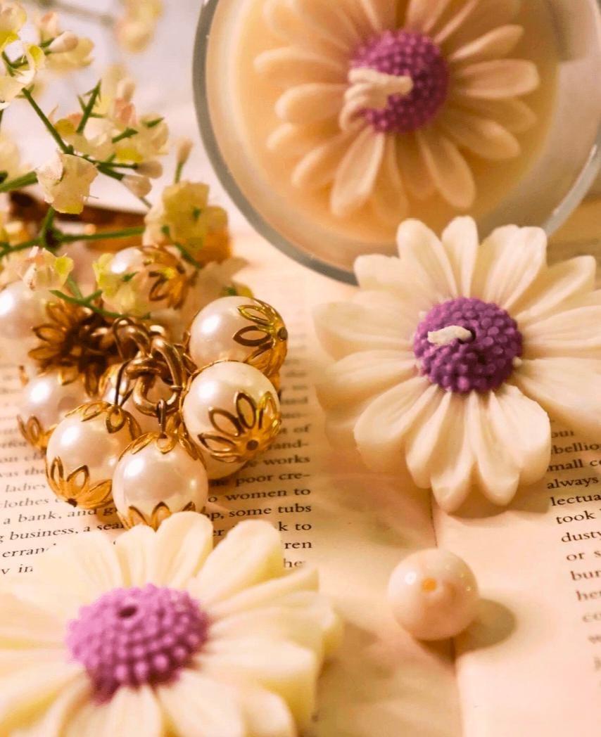 Decorative cookies shaped like flowers with purple centers on a surface with text.