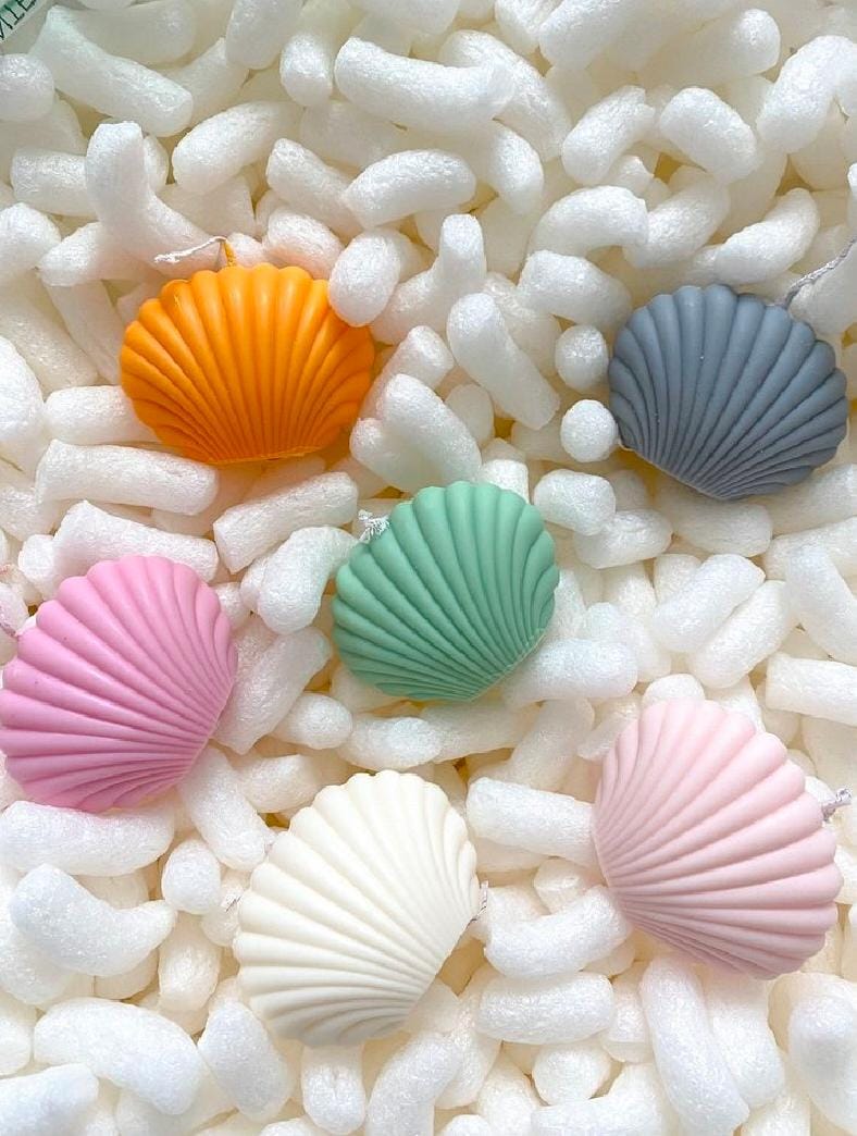 Colorful shell-shaped candies on a bed of white foam balls