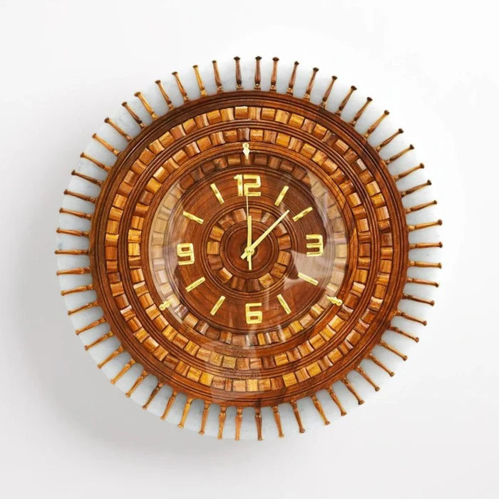 Wooden wall clock with decorative design on a white background