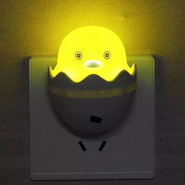 Yellow cartoon-like night light on a dark background