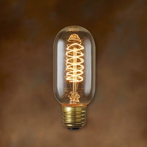 Vintage-style light bulb with spiral filament on a brown background