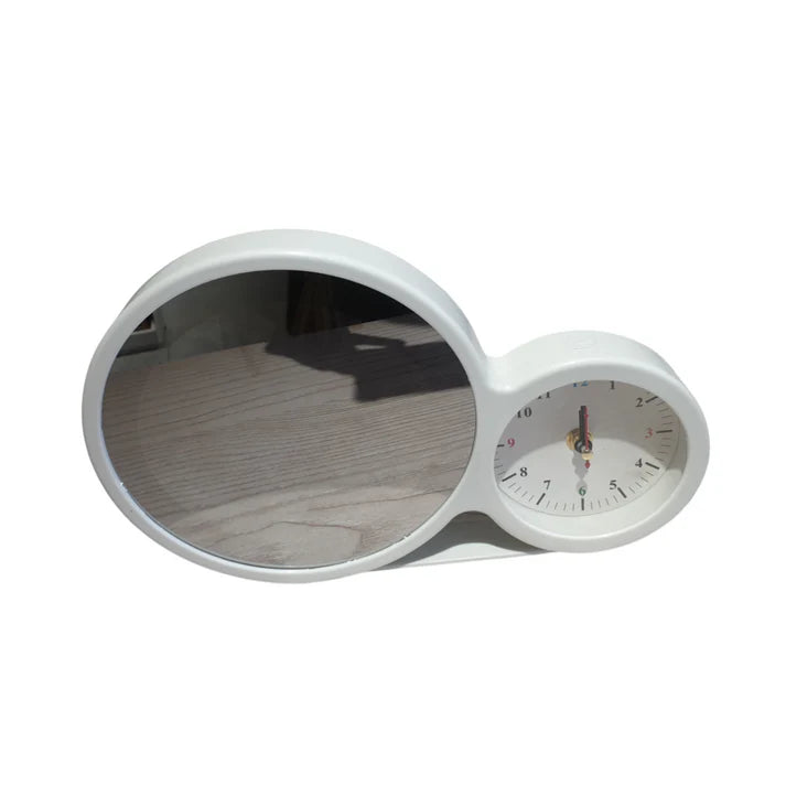 White oval mirror with clock on a white background