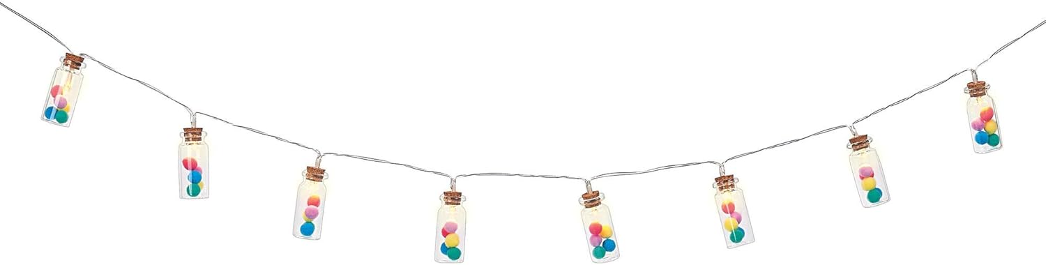 String lights with colorful beads and small bottles on a white background