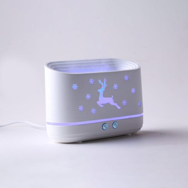White electronic device with deer and snowflake design on a light gray background
