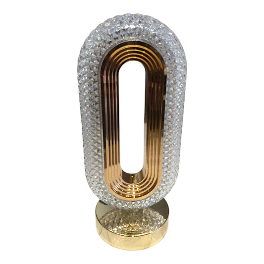 Decorative object with crystal embellishments and gold accents on a white background