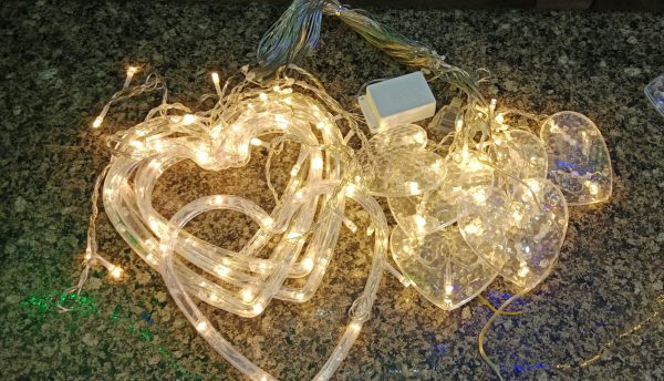String lights with clear bulbs on a textured surface