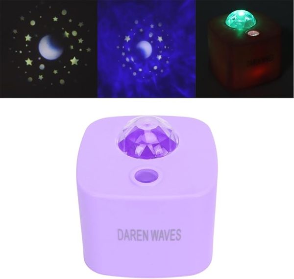 Purple light projector with star and moon patterns on a dark background