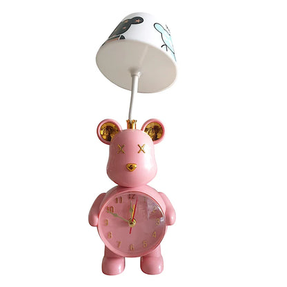 Pink teddy bear-shaped clock with a lamp on a white background